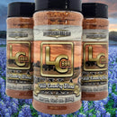 LC BBQ Hill Country Blend Everything BBQ Rub LC BBQ on background of bluebonnets in Texas Hill Country.