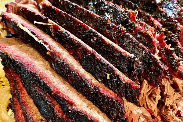 step-by-step guide to smoking brisket with trimming, seasoning, and slicing tips