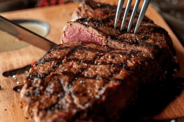 how to cook steak on a charcoal grill with expert grilling techniques