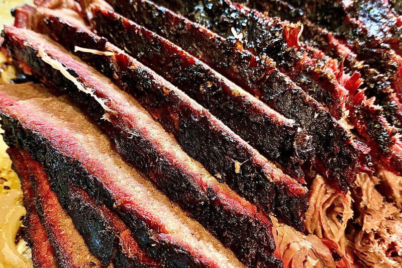 step-by-step guide to smoking brisket with trimming, seasoning, and slicing tips