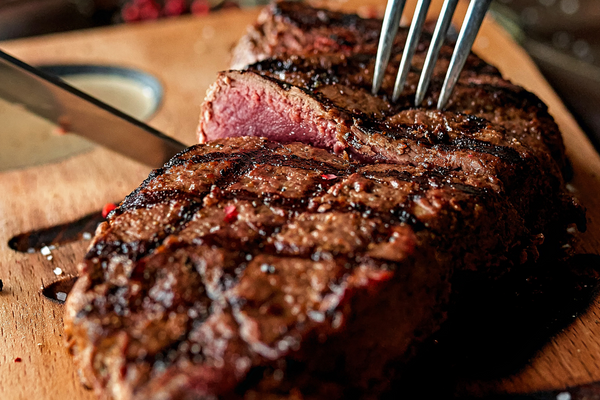 how to cook steak on a charcoal grill with expert grilling techniques
