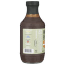 A bottle of WarPig BBQ’s War Pig FUBAR Flamethrower BBQ Sauce is displayed with the back label visible, featuring text highlighting veteran support, a barcode, and a partially visible nutrition facts panel. The sauce itself boasts a rich dark brown color and comes topped with a black cap, hinting at the bold and spicy flavors within—ideal for those who crave the heat of this fiery barbecue sauce.