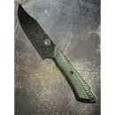 The Spaceman Knives Gravity Series Chef Knife features a Damascus-patterned AUS-10 steel blade and a textured green and black handle, shown resting on a dark, speckled surface.