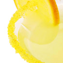Close-up of a yellow drink in a glass rimmed with The Spice Lab Lemon Drop Sugar Cocktail Rimmer from The Spice Lab, garnished with a lemon slice. This vibrant citrus cocktail is set against a clean white background.