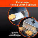 A stainless steel spatula holds a cheesy burger patty, while the Braize Smash Burger Press Kit’s 9" x 12" clear melting dome covers another on the grill. Text: Braize Smash Burger Press Kit—perfect for burgers or steaming veggies!.
