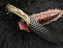 The Texan Knives Custom Forged 1095 High Carbon Steel Hunting Knife features a 12" antler horn handle, a textured black blade, and comes with a handmade leather sheath, all displayed on a black fur surface.