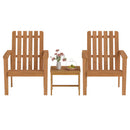 Two wooden chairs with vertical slats sit on either side of a 17″ Square Acacia Wood Side Table with Slatted Top by DirectDeals, which holds a vase of pink flowers, fruit plate, and glass teapot.