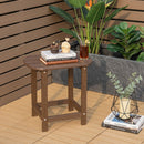 The 18″ Weather Resistant Outdoor Side Table - HDPE Construction by DirectDeals sits on a patio with books, a cupcake, and a drink. Beside it on the floor are a vase with eucalyptus and a book near potted plants and a fence.