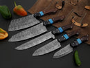 The Texan Knives Best Chef Knives Set features a 13" handmade Damascus steel kitchen knife with a wenge resin handle and includes a leather sheath, displayed beside a knife roll and colorful peppers.