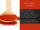 A wooden spoon filled with red paprika powder rests beside text highlighting the flavor and origin of Spice Wheel Hungarian Paprika from Spice Wheel, set against a striking red and black background that evokes the rich traditions of Hungarian cuisine and showcases the vibrant hue of this sweet paprika.