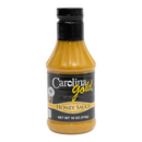 A plastic squeeze bottle of Gourmet Carolina Gold Honey Carolina Gold BBQ Sauce with a black cap and label.