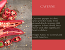 Slices of red cayenne peppers with seeds lie on a wooden surface, set beside a dynamic red and black background showcasing Spice Wheel Cayenne Pepper’s origins and bold flavor profile—a vibrant tribute to the chili peppers that give Spice Wheel Cayenne Pepper - Glass Jar its signature heat.