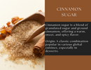 A wooden scoop brimming with Spice Wheel Cinnamon Sugar—a fragrant mix of granulated sugar and ground cinnamon—spills onto the surface beside a cinnamon stick and raisins. Accompanying text highlights Spice Wheel Cinnamon Sugar’s unique blend, robust flavor, heritage, and its lasting appeal in desserts.