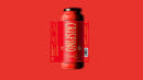 A glass bottle of Taycte Famiglia Crispino Calabrian Chili Pasta Sauce Starter — Peperoncino with a red label and white text, shown on a solid red background. The label features product details and a barcode.
