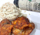 Cooked chicken and rice are served on a plate, with Terrapin Ridge Farms Pesto Aioli Squeeze sauce being poured over the rice. The flavorful basil and garlic aioli from Terrapin Ridge Farms is also visible on the plate.