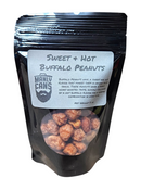 A black resealable bag from Manly Cans, featuring the Manly Cans Nut Gift Can, displays honey roasted peanuts inside through a clear window as part of their savory snack assortment.