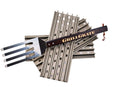 A metal grill spatula labeled GRILLGRATE rests on top of several silver grilling grates with holes, all set against a white background—part of the Smokin Brothers GrillGrate Searing Set designed to create steakhouse-style sear marks from Smokin Brothers.