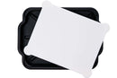 A Smokin Brothers Prep & Slice Cutting Board with Tray, featuring a white rectangular cutting board with rounded corners, is placed at an angle on top of the black tray with raised edges.