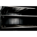Close-up view of the interior of a Smokin Brothers Premier Vertical by Smokin Brothers, featuring multiple metal racks and a sleek black finish—engineered for ultimate temperature control, making it ideal for precision cooking in any setting.