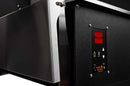 Close-up of a black industrial machine with a metal side panel and a control panel featuring digital red display, power button, and warning label—ideal for enhancing your grill workspace or pairing perfectly with the Smokin Brothers Stainless Steel Side Shelf for Premier and Premier Plus Models.