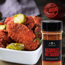 A bowl of Nashville hot chicken wings topped with pickles sits next to a jar from The Spice Lab Taste of America Seasoning Collection. In the background, a red “Perfect for All-Around Cooking” stamp highlights this bold American-inspired spice blend by The Spice Lab—ideal as a grilling seasoning or for adding a flavorful kick to all your favorite dishes.