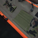 Close-up of the Messermeister Camouflage Knife Roll - 8 Pocket, featuring olive green and camouflage pockets, black mesh, and bright orange zippers with black pulls. Messermeister ensures this roll is durable for your culinary essentials.