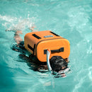 A person wearing a black cap and snorkel swims in a pool while carrying the Bob The Cooler Co. 25L "The Bro" Backpack Soft Cooler—a durable backpack cooler with an airtight lid from Bob - The Cooler Co.—strapped to their back.