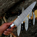 A hand holds the Texan Knives 13" Handmade Damascus Steel Chef Knife with an epoxy resin handle and leather sheath; other matching pieces from this premium kitchen knife set are displayed on a wooden plank in the background.