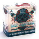 A clear box featuring a decorated skull design holds two Himalayan Salt Tequila Shooters by The Spice Lab, made from 100% Pink Himalayan salt—perfect for savoring your favorite tequila. The packaging reads “Salt Shooters: The Spice Lab Himalayan Salt Tequila Shooters 2 Pack.”.
