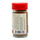 A glass spice jar with a red lid features a nutrition facts label, ingredient list, barcode, and manufacturer information from Powerful Pepper Company on the back. The jar contains Powerful Pepper Steak Seasoning No. 5—a brownish gourmet blend ideal for seasoning steak or adding the rich depth of black garlic to your favorite dishes.