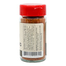 A clear spice jar from Powerful Pepper Company with a red lid features a white label facing the camera, listing ingredients and nutrition facts. The jar is filled with Powerful Pepper Cajun Blackening Seasoning, a reddish-brown blend inspired by Chef Paul Prudhomme.