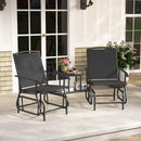 The DirectDeals 2-Seater Outdoor Glider Bench with Center Table sits on a porch by white French doors, with patio seating, plants, and outdoor lights in the background.
