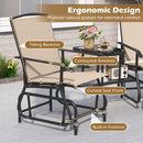 The DirectDeals 2-Seater Outdoor Glider Bench with Center Table features a tilting backrest, contoured armrests, curved seat front, and built-in footrest for ergonomic comfort. Text above reads Ergonomic Design for comfort.