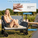 A woman relaxes on the 2-in-1 Collapsible Wagon Bench Seat with Adjustable Handle by DirectDeals, enjoying plush high-resilience cushions in a cozy campsite surrounded by tents and greenery.