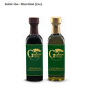 Two mini 60ml (2oz) glass bottles feature green labels with the Georgetown Olive Oil Co. branding and the tagline "A Fresh Approach to Healthy Lifestyle"; one bottle has a dark cap, the other a gold cap. This elegant set includes customer favorites: Black Truffle Balsamic Vinegar and Black Truffle Gourmet Olive Oil, both from Georgetown Olive Oil Co.