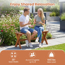 A man and woman chat on the DirectDeals Outdoor Wood Bench Set of 2 - 36 Inch Backless Patio Seating, which seats 2, holds up to 660 lbs, and sits amid flowers in a lush garden.