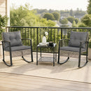 The DirectDeals 3-Piece Outdoor Rocking Chair Set with Coffee Table - Gray offers cozy patio seating, featuring two cushioned rockers and a table, perfect for relaxing amid greenery under a clear sky.