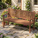 The DirectDeals 3-Seater Wooden Garden Bench with Backrest, 59 Inch sits on a stone patio amidst vibrant flowers and greenery, offering inviting outdoor seating beside a beige house.