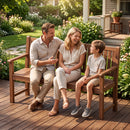 A smiling family of three enjoys a cheerful chat on the DirectDeals 3-Seater Wooden Garden Bench with Backrest, 59 Inch on a sunny porch surrounded by greenery and flowers.