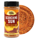 A bottle labeled Chiles & Smoke Scorching Sun Sweet Heat Rub by Chiles and Smoke, featuring a close-up of the orange-red spice mix with visible bits of seasoning. Ideal for those craving Southwest chile heat, this spicy BBQ rub highlights chiles, pepper, and garlic as main ingredients on the label.