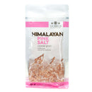 A clear bag of The Spice Lab Himalayan Pink Salt Coarse Grain, labeled 100% pure, natural, and unrefined. The coarse pink salt crystals from The Spice Lab are visible through the packaging and ideal for refilling your favorite salt grinder.