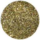 A close-up view features a round pile of The Spice Lab French Lavender + Rosemary Seasoning, showcasing a blend of green, white, and brown leafy and granular textures from this savory herb mix. This sugar-free seasoning from The Spice Lab spotlights the vibrant combination of dried herbs for an aromatic culinary experience.