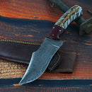 The Texan Knives Best Knives for Hunting features an 8.5" Damascus steel blade, a unique pine cone resin handle, and comes with a brown leather sheath—making it an excellent choice for hunting enthusiasts.