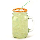 A mason jar filled with a light green, iced beverage, topped with a rim of The Spice Lab Chili Lime Margarita Salt Cocktail Rimmer by The Spice Lab, and finished with a green-striped straw.