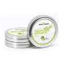 Three round metal tins labeled The Spice Lab Traditional Margarita Salt Cocktail Rimmer by The Spice Lab are stacked, with one tin standing upright to display a margarita glass illustration on the label—making it the perfect cocktail rimmer for any margarita lover seeking premium margarita salt.