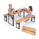 Two children enjoy snacks at the DirectDeals 43.5 Inch Folding Kids Picnic Table & Bench Set No Assembly Wooden Toddler Table, with the folded set displayed in front and food and drinks on the table.