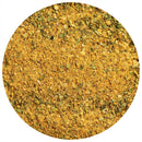 A close-up of The Spice Lab Adobo Seasoning, a yellow-brown all-purpose blend mixed with green herb flakes, is shown against a white background in a circular frame. This seasoning from The Spice Lab offers a Latin-inspired flavor that enhances any dish.