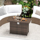 The 44.5 Inch Propane Fire Pit Table Rattan Gas 2-in-1 with Stainless Steel Burner by DirectDeals is set on a round rug with drinks, fruit, and white cushioned seating, surrounded by plants and flowers outdoors.
