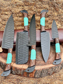 Texan Knives' Premium Knife Set features 13" forged stainless steel blades with wenge wood and resin handles, plus a leather sheath. Five knives stand upright on a tree stump in front of a woven straw backdrop.