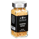 A glass jar of The Spice Lab Scorpion Pepper Sea Salt features a silver lid and black label, showcasing the vibrant spice blend inside. This XXX Hot seasoning from The Spice Lab delivers extreme heat in every sprinkle. Net weight: 3.3 oz (93g).